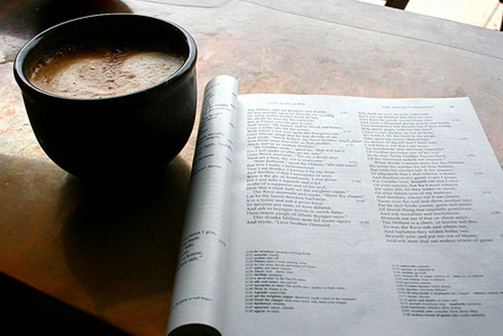 coffee mug with book adjacent